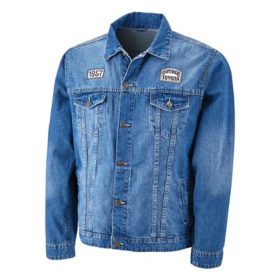 Blue denim jacket with two white and black woven patches on  chest. Left Chest has a vintage Toyota logo, right chest has the year 1957.