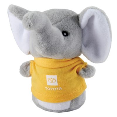 Small stuffed elephant with Toyota logo printed in white on yellow t-shirt.
