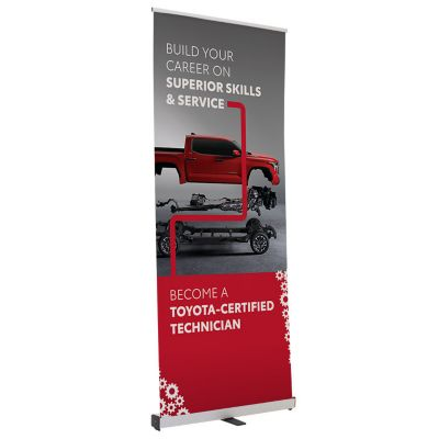 Vertical banner with the text 'BUILD YOUR CAREER ON SUPERIOR SKILLS & SERVICE BECOME A TOYOTA-CERTIFIED TECHNICIAN,'featuring a red Toyota truck with exposed chassis and mechanical components,set against a gray and red background with white gear graphics