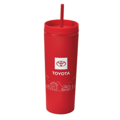 A red travel tumbler with a straw, featuring the Toyota logo and the word 'TOYOTA' in white. Below the logo, there is a white graphic of a cabin, trees, and a truck