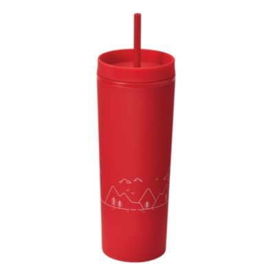 Red tumbler with a lid and straw, featuring a white line drawing of mountains, trees, and birds on its surface.