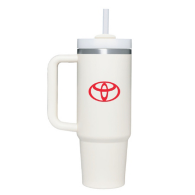 A white travel mug with a handle and a lid featuring a straw. The mug has the Toyota logo in red on the front