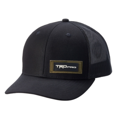  Black baseball cap with a curved brim and mesh back. The front features a rectangular patch with ""TRD Pro"" in white letters on a dark green background.