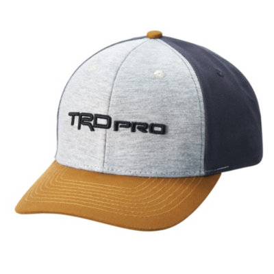 A baseball cap with a grey front panel, black side and back panels, and a brown brim. The front panel has the text 'TRD Pro' embroidered in black