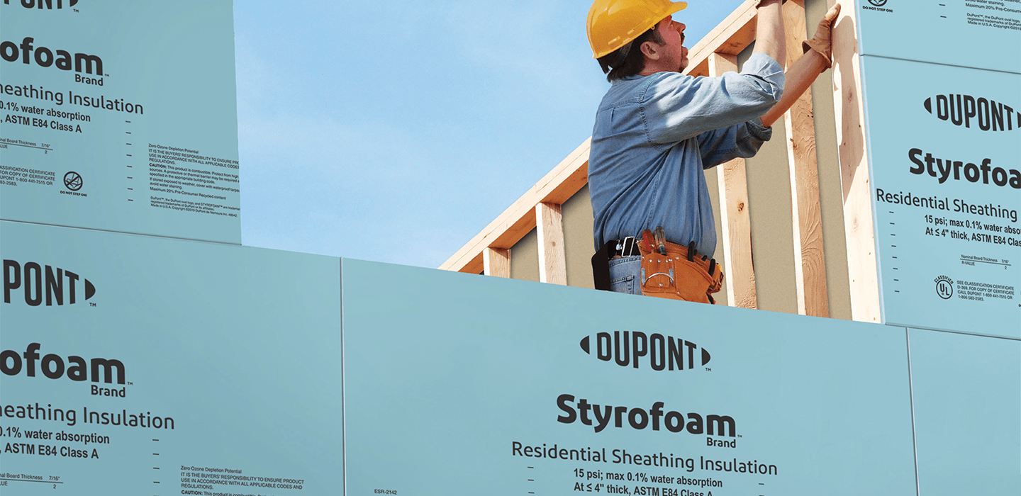 Insulation of the house with polyfoam. The worker is installing a