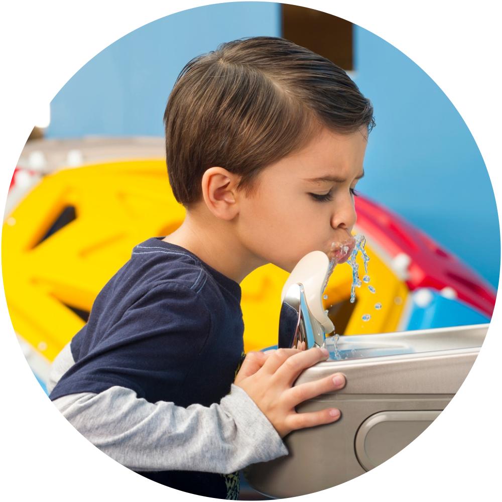 Little Boy Drinking from an Elkay Water Fountain