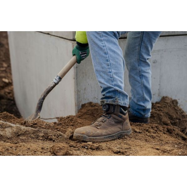 A pair of rugged work boots with a BOA fit system on the gusset for quick in and out.