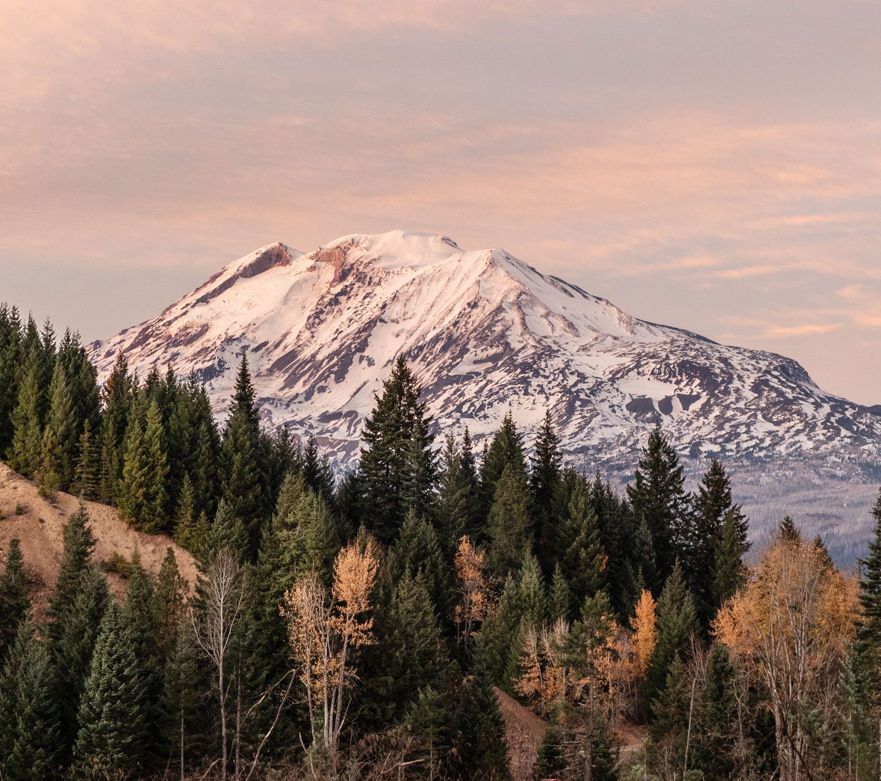 landscape photo of a snowy mountain in autumn