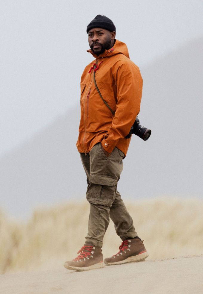 man standing on the sand surveying his scene
