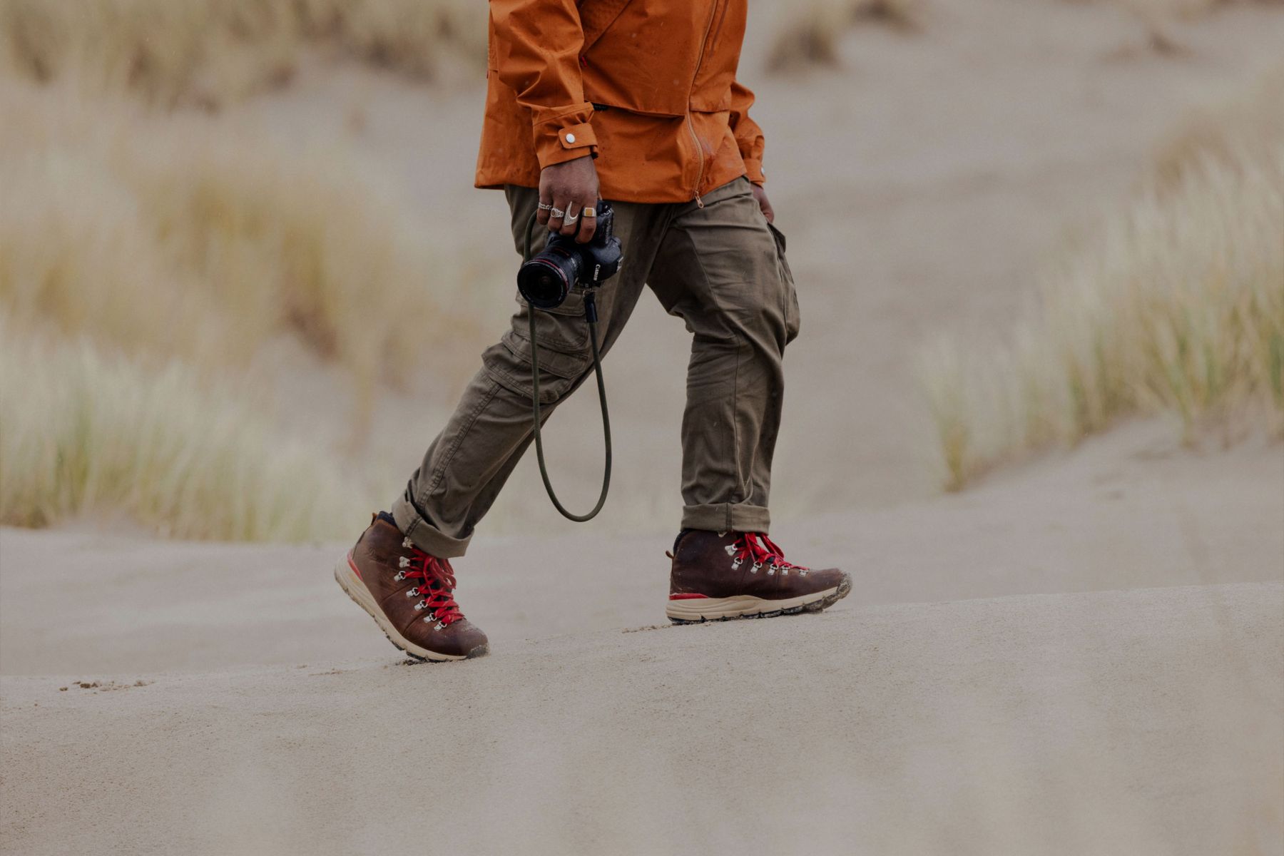 man hiking on the dunes