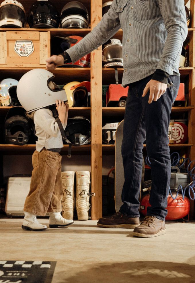 man with kid with bike helmet
