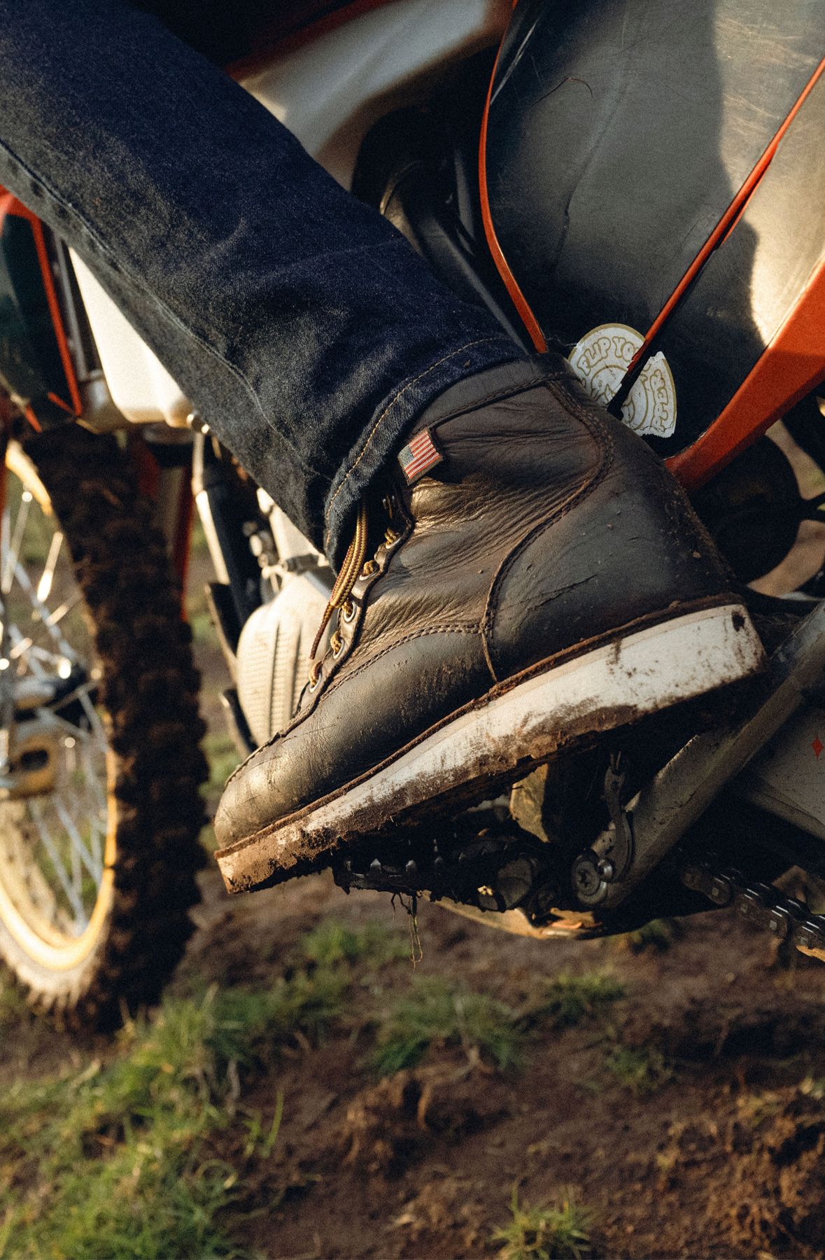 The outsole of a boot is shown on a motorcycle