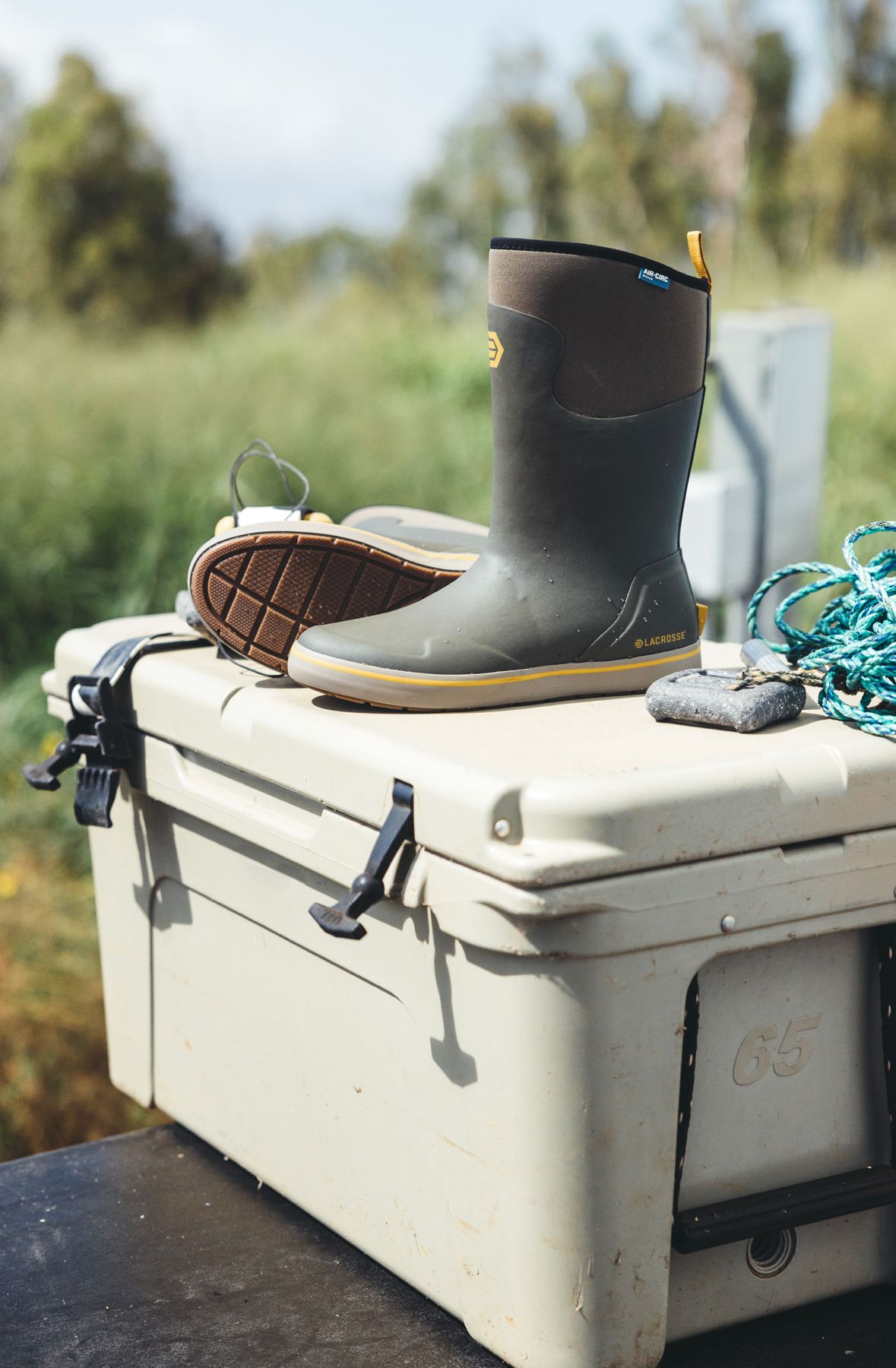 A rubber boot and other hunting gear