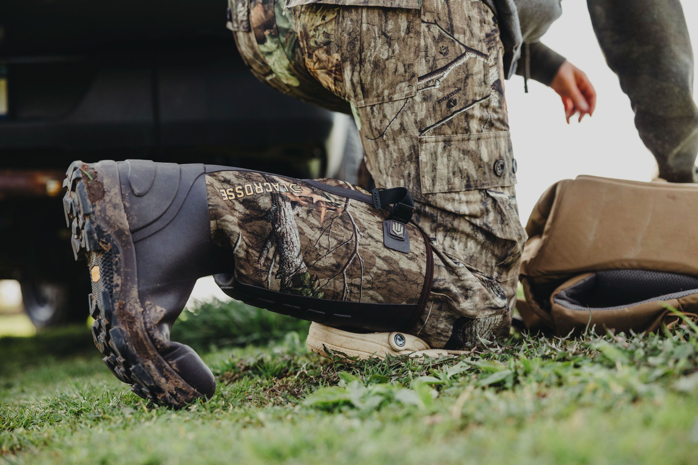 a man kneeling down in camo