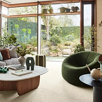 maximalist living room scene with karastan carpet