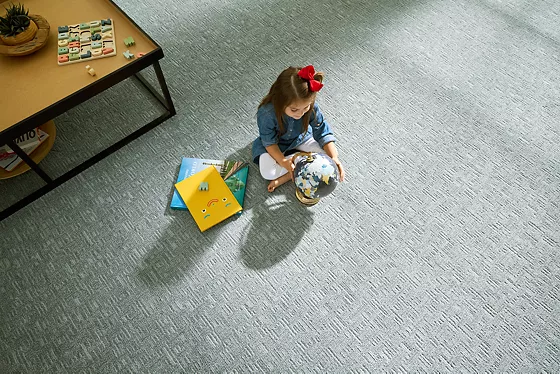 child recycling plastic bottles