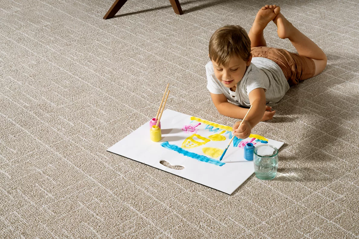 boy water coloring on carpet