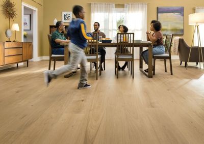 a metal ball being dropped on a wood floor