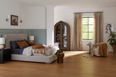 Bedroom with rich brown wood floors