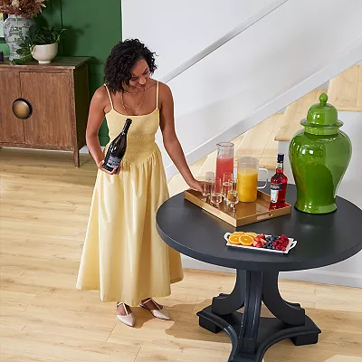 Woman decorating her home on top of Karastan waterproof wood