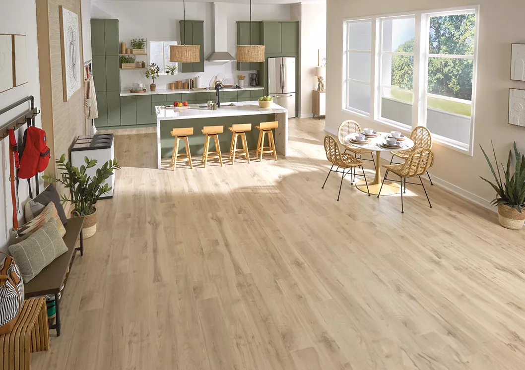 Light flooring in an olive green kitchen