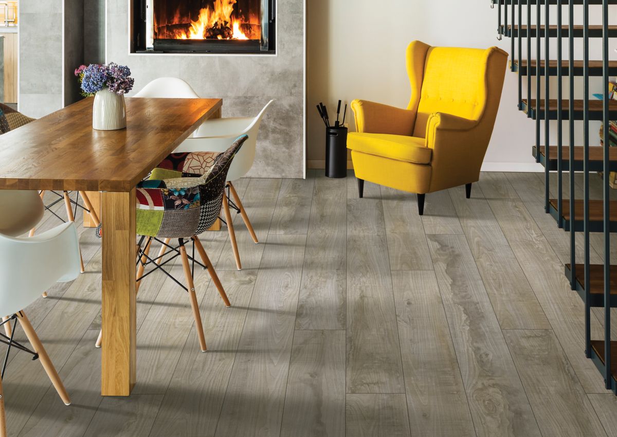 Cool gray luxury vinyl plank flooring in cozy kitchen