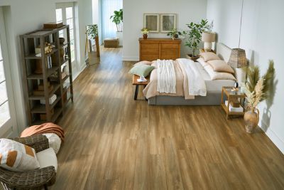 Bedroom with vinyl floors with a wood look