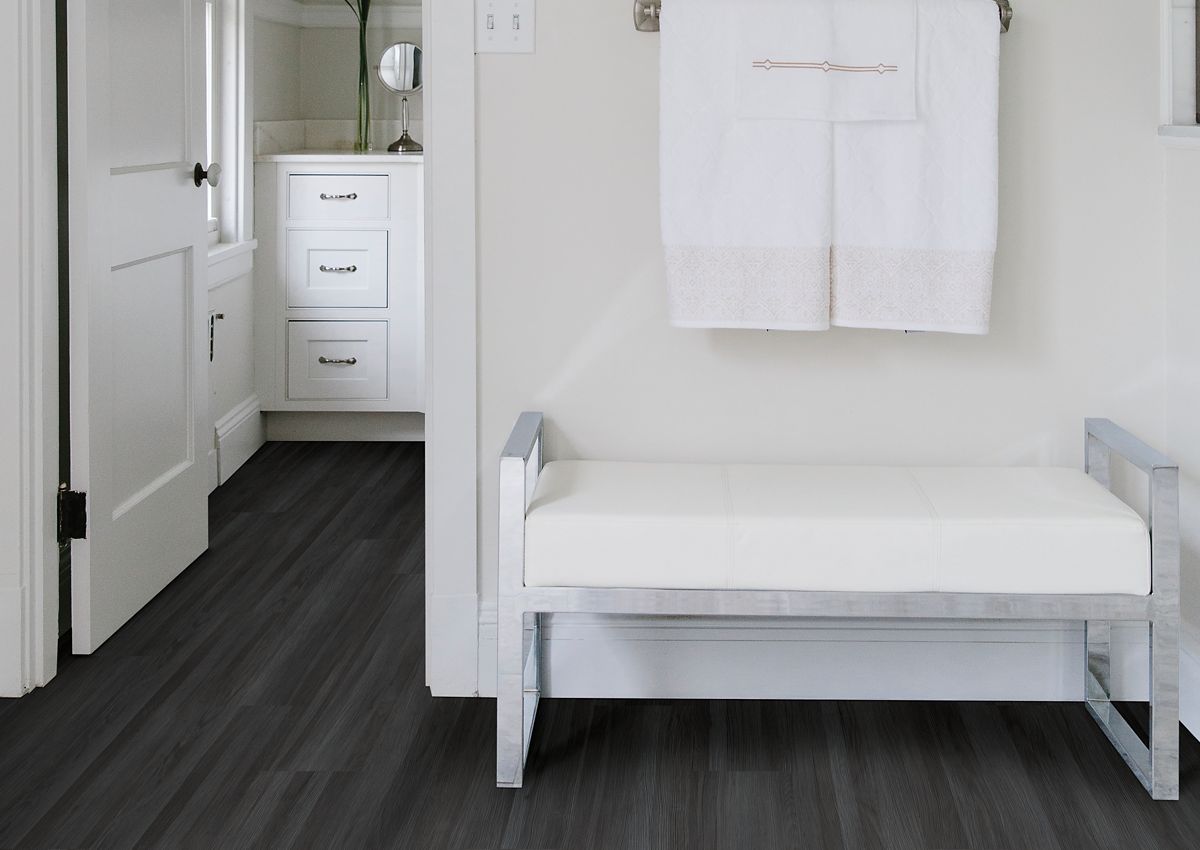 waterproof charcoal grey hardwood floors in crisp white bathroom
