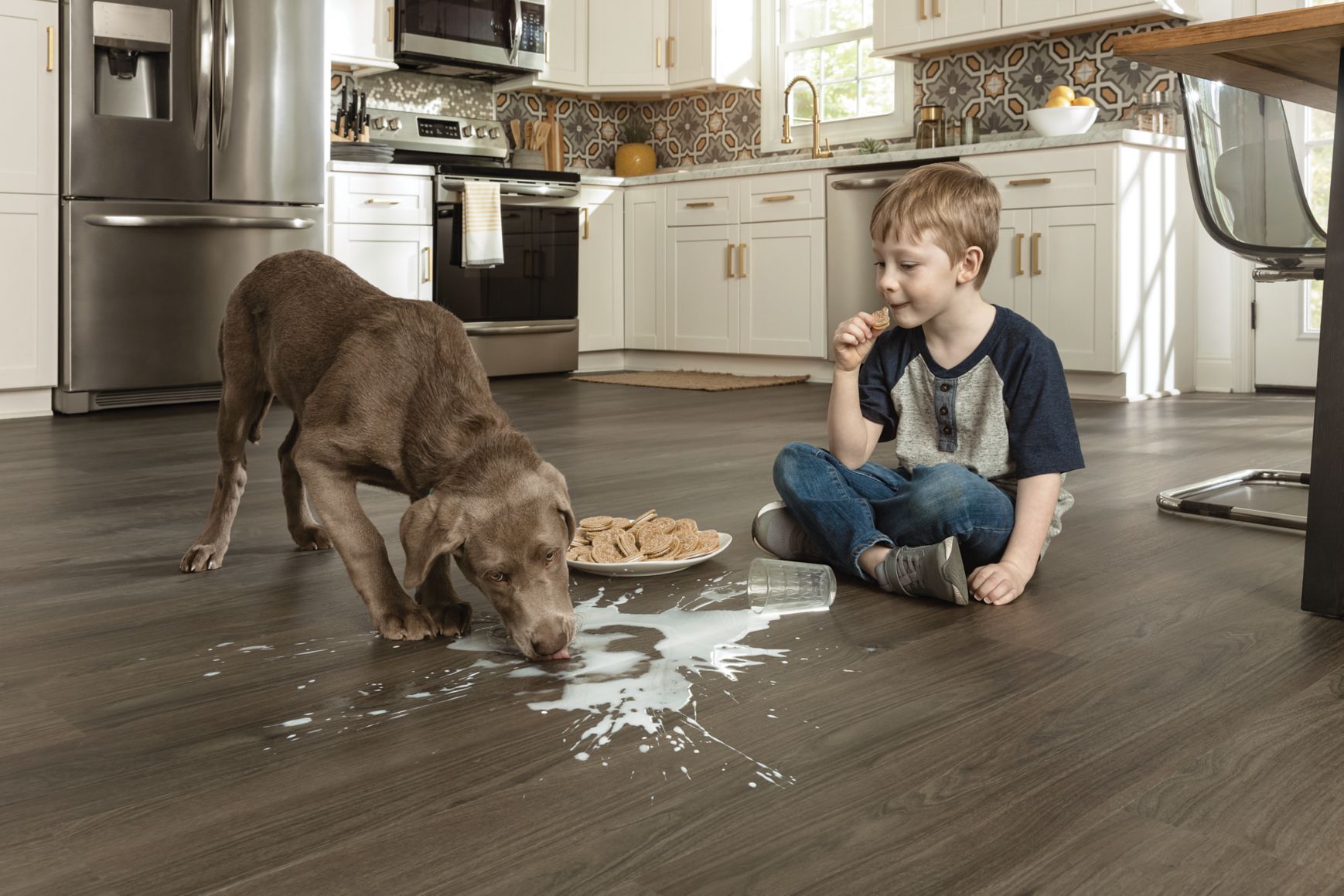 pet-friendly floors in kitchen with dog and child making mess
