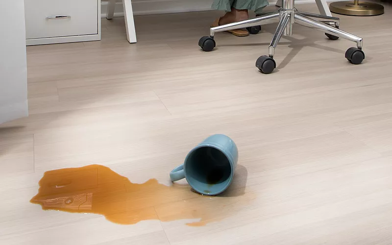 baby playing on hardwood floors