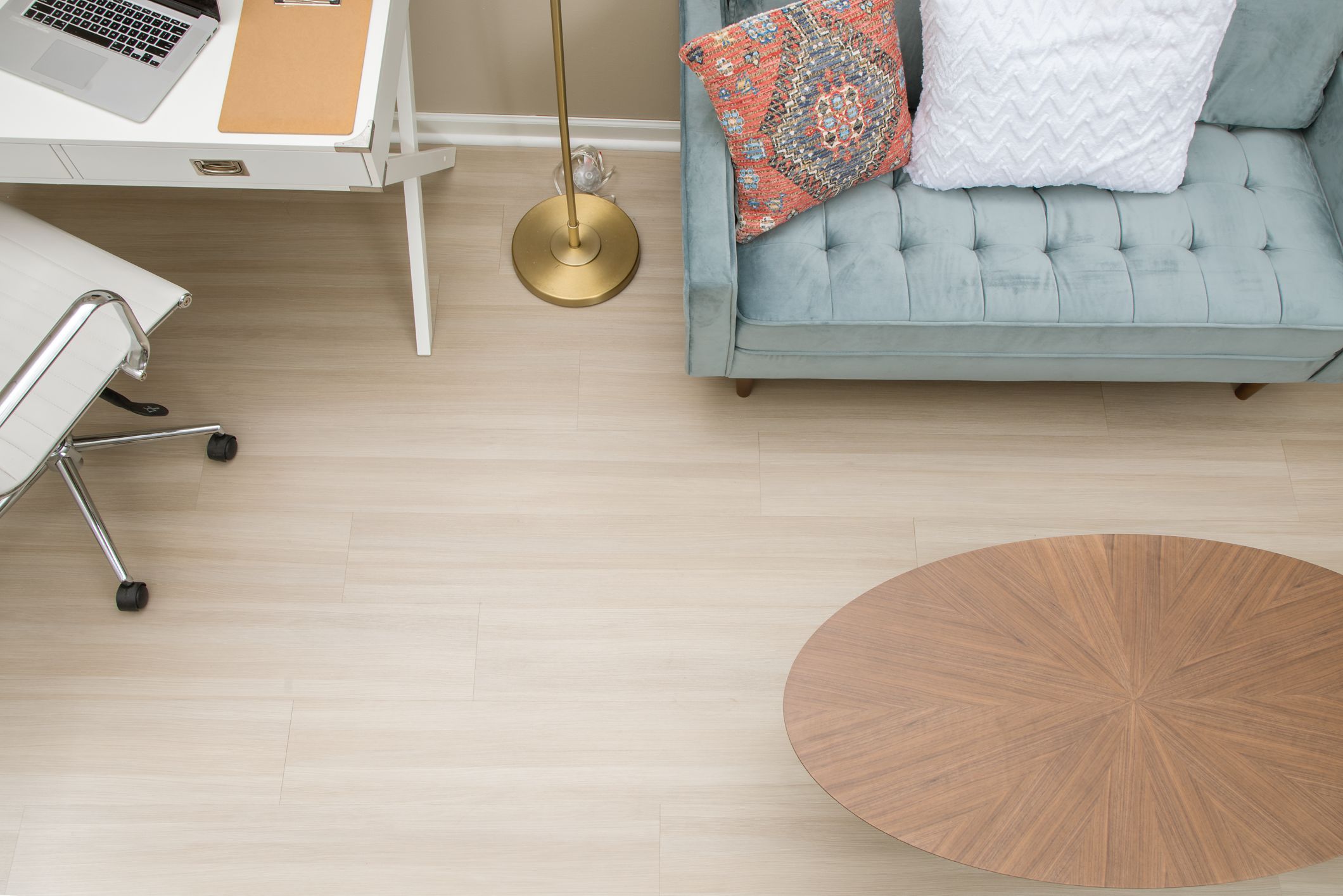 family in a kitchen with grey hardwood floors