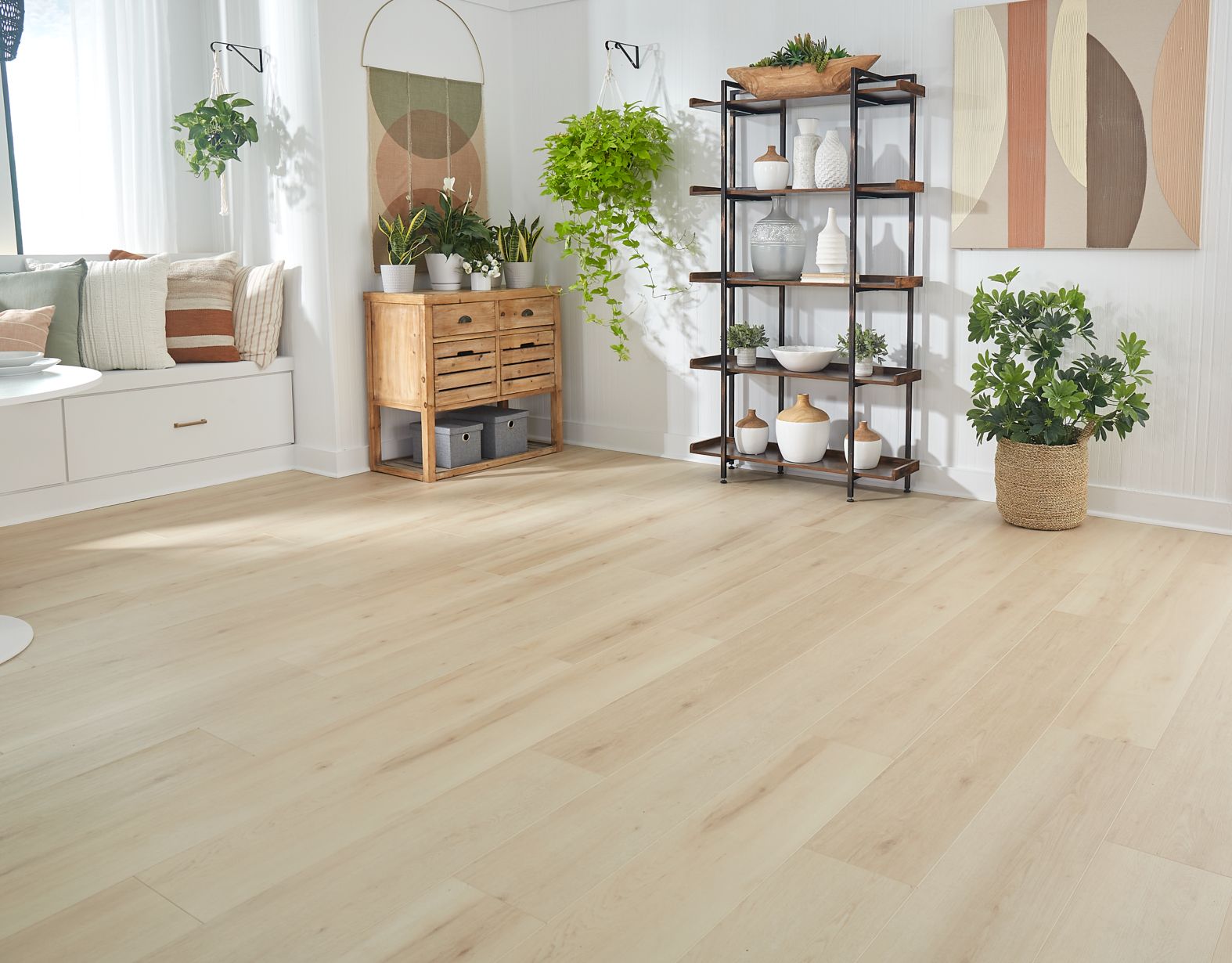 family in a kitchen with grey hardwood floors