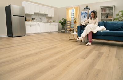 Light brown hardwood flooring and a trombone case