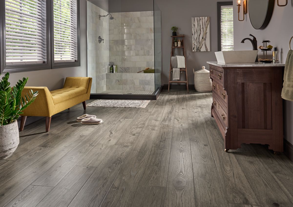 Light gray hardwood floors in a large master bathroom