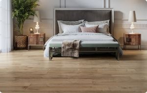 bedroom with brown hardwood flooring
