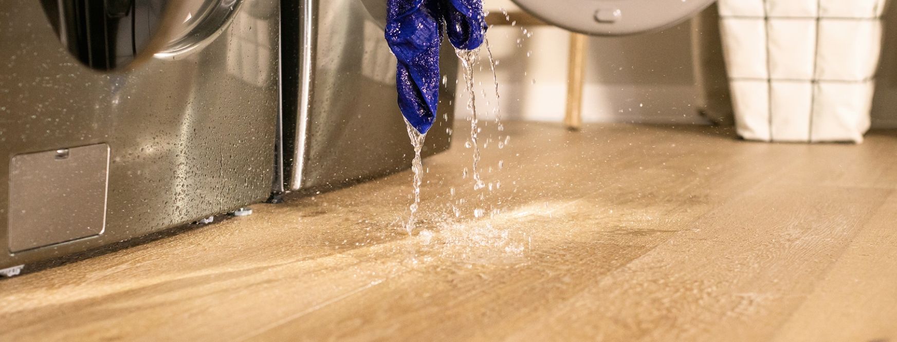 wet launmdry spilling water on hardwood flooring