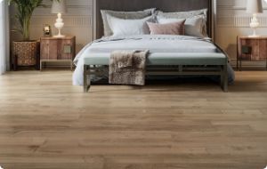 bedroom with brown hardwood flooring