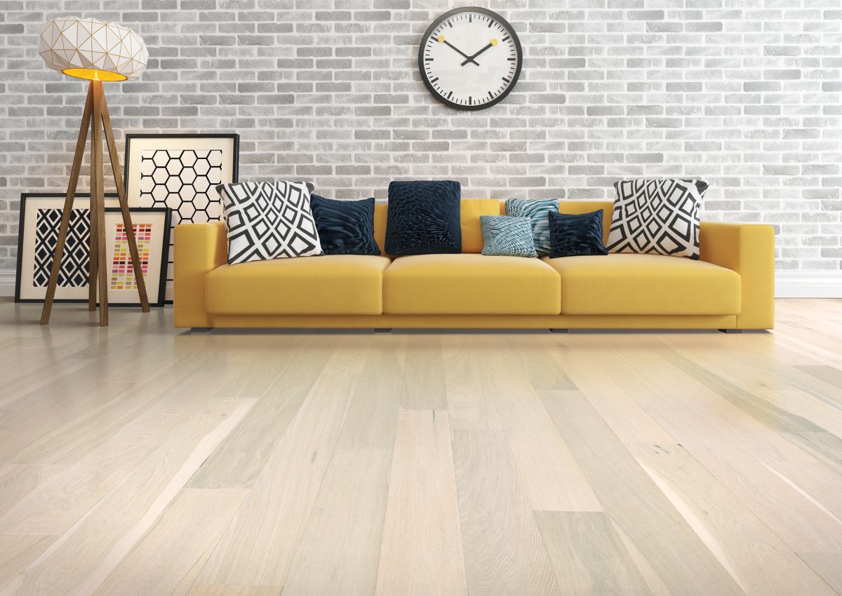 minimalist living room with light brown hardwood flooring