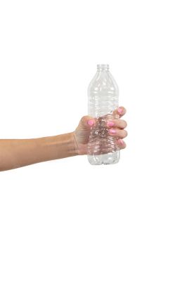 A close-up of a woman's hand holding a plastic bottle, emphasizing everyday life and sustainability.