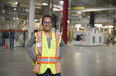 employee in Thomasville, Georgia factory with yellow safety vest on
