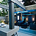 Sleek and modern, this Trex deck lighting idea shows off a cozy entertainment space with Outdoor Lighting.