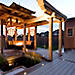 Set the night aglow with the combination of Trex Deck Lighting and the fire pit featured in the center of this pergola.