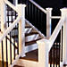 Deck lighting from Trex adds a touch of elegance to this classic white railing.