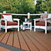 Nestled amongst the trees, this deck idea from Trex invokes summer vibes by decking in Beach Dune.