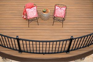 Overhead shot of curved Trex Signature railing with Transcend decking in Havana Gold.