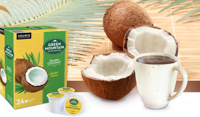 Island Coconut K-Cups next to a mug of coffee and coconuts