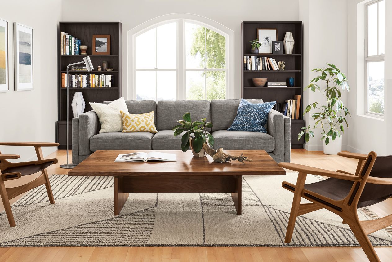 living room with mixed wood furniture